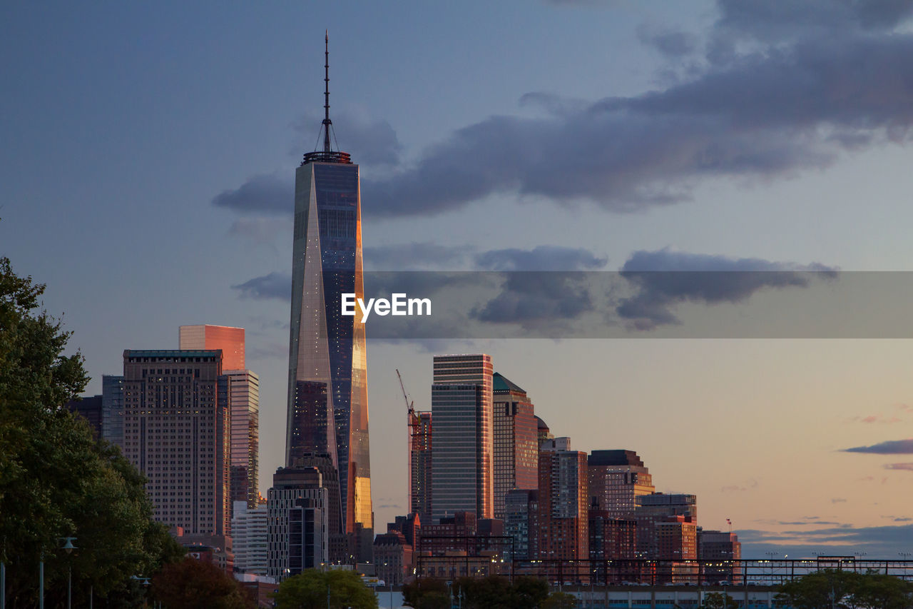 MODERN BUILDINGS IN CITY AGAINST SKY