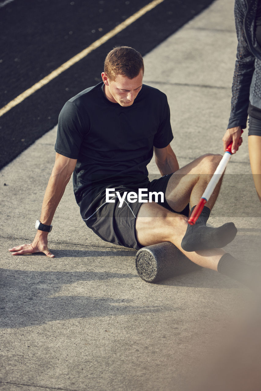 Athlete stretching at stadium