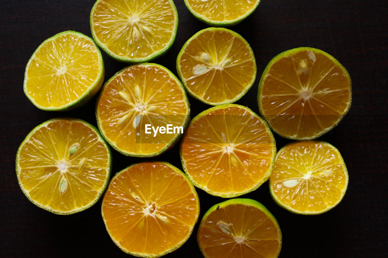 Directly above shot of oranges against black background