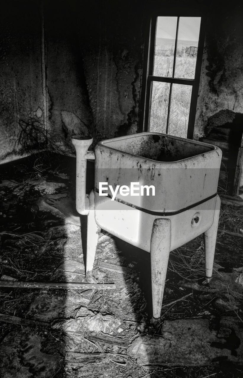 High angle view of old washing machine in abandoned farmhouse