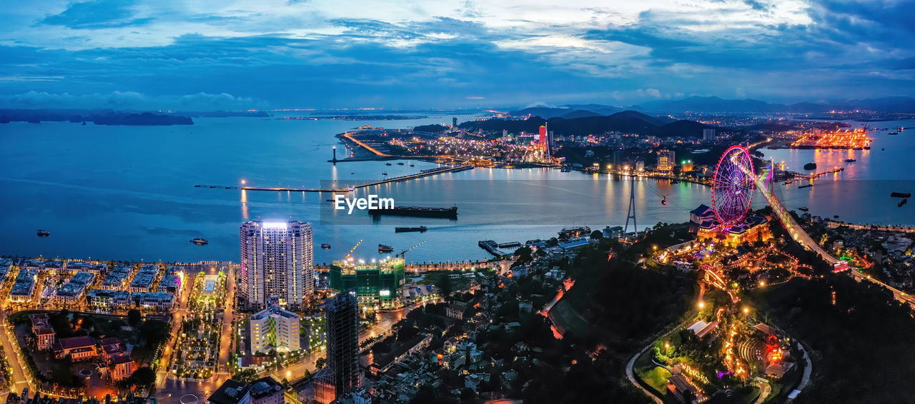 High angle view of city lit up at night