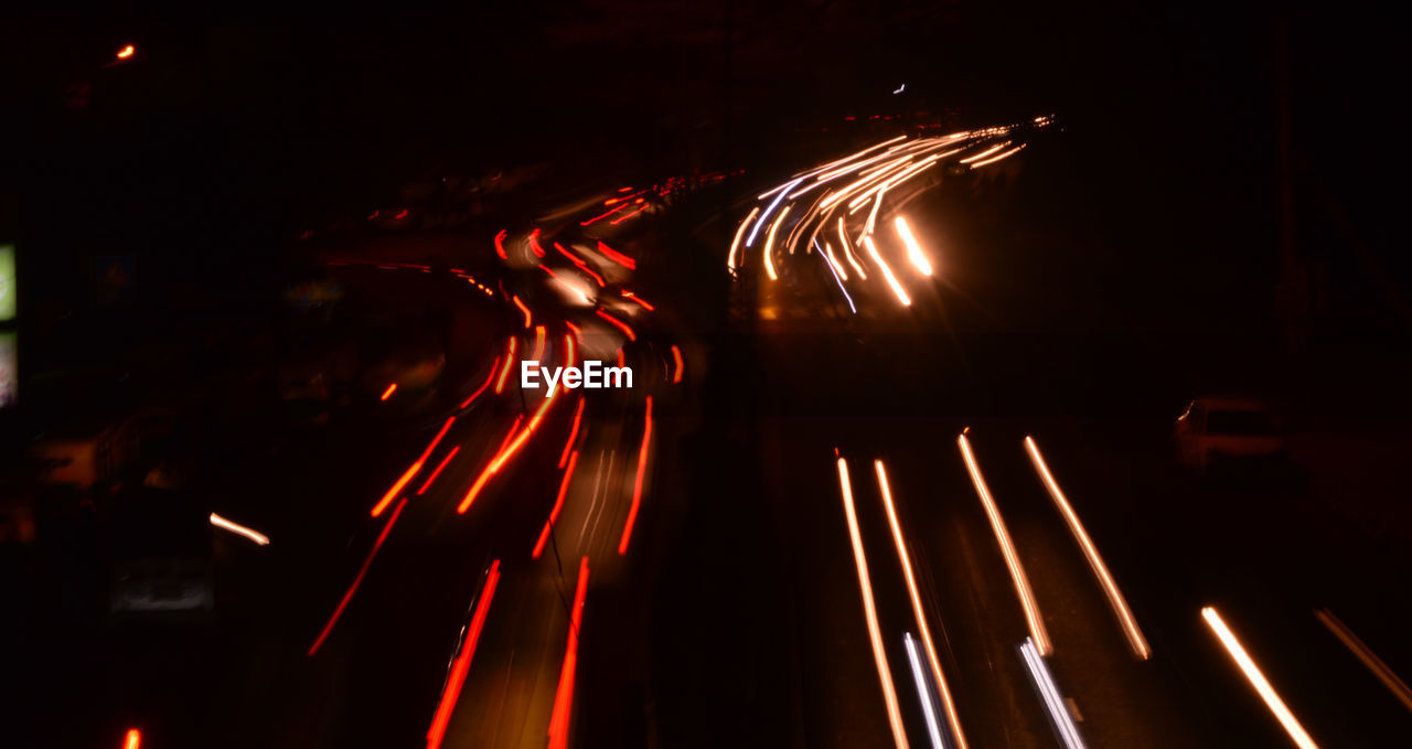 High angle view of light trails on road at night