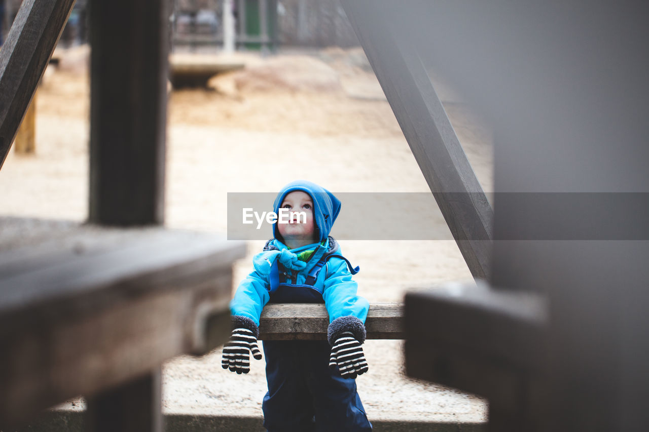 Boy in playground during winter