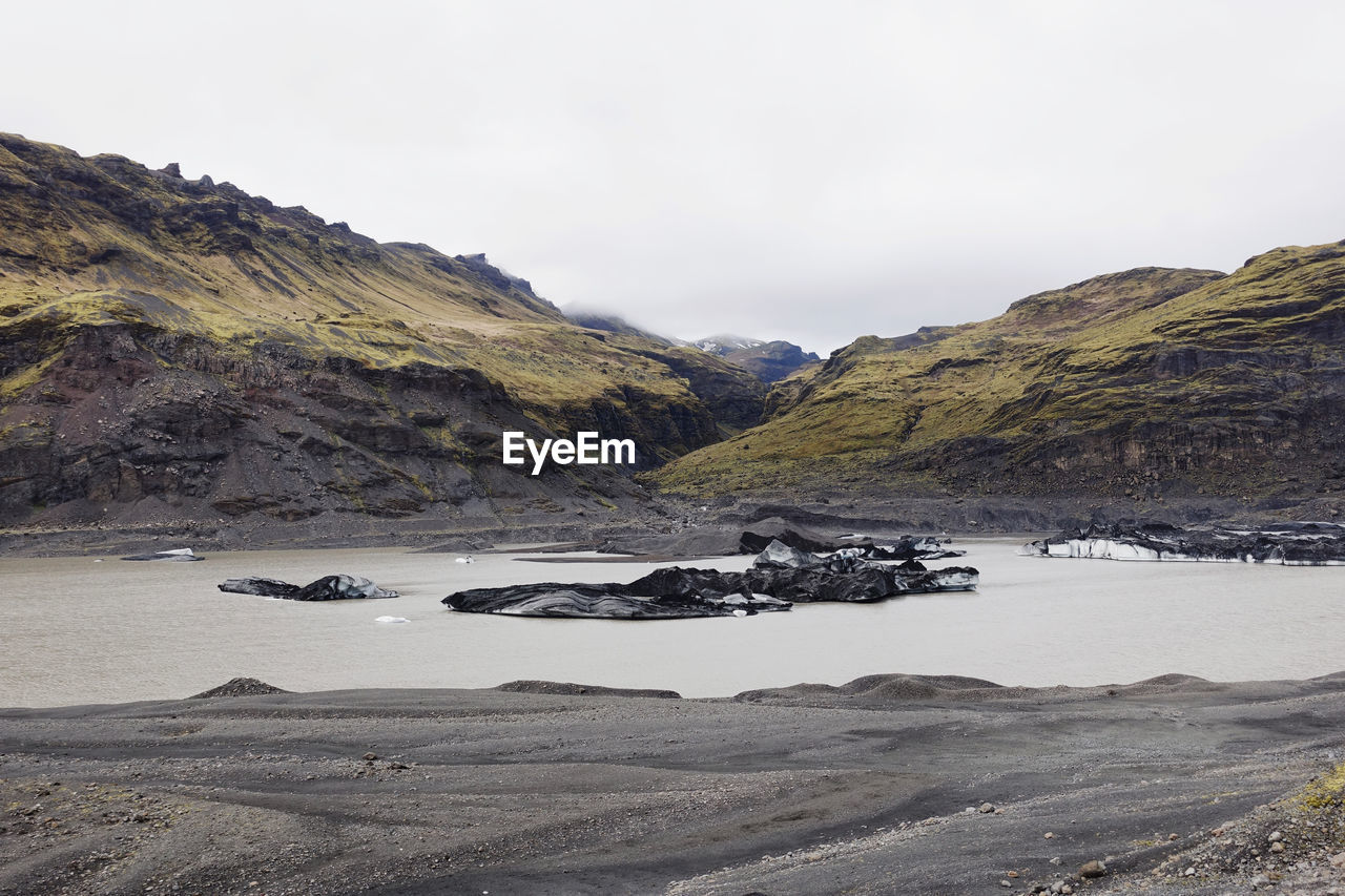 SCENIC VIEW OF MOUNTAINS AND SEA