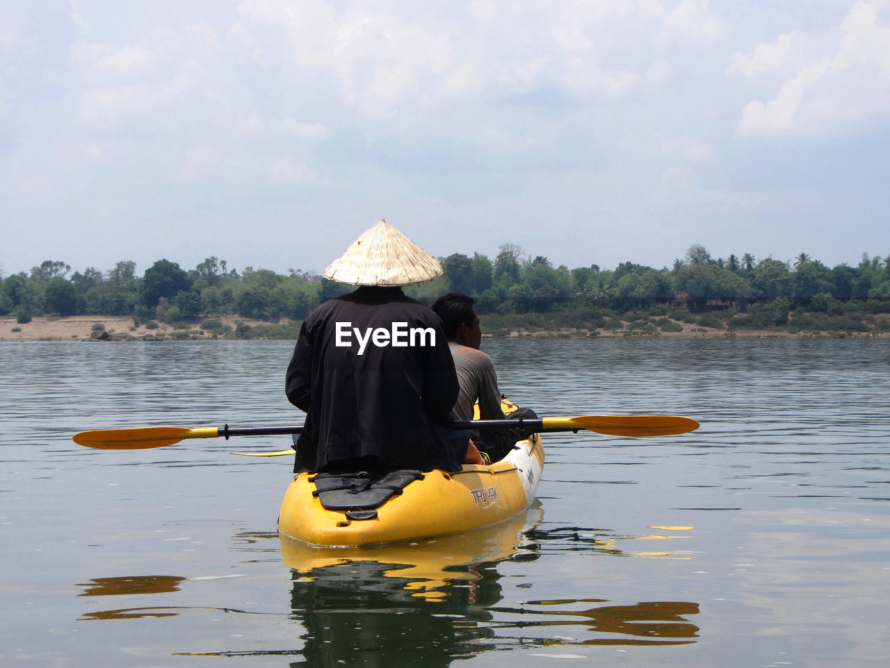 Rear view of two men in kayak