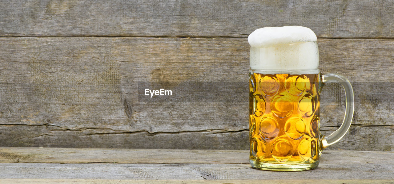 Close-up of beer glass on table