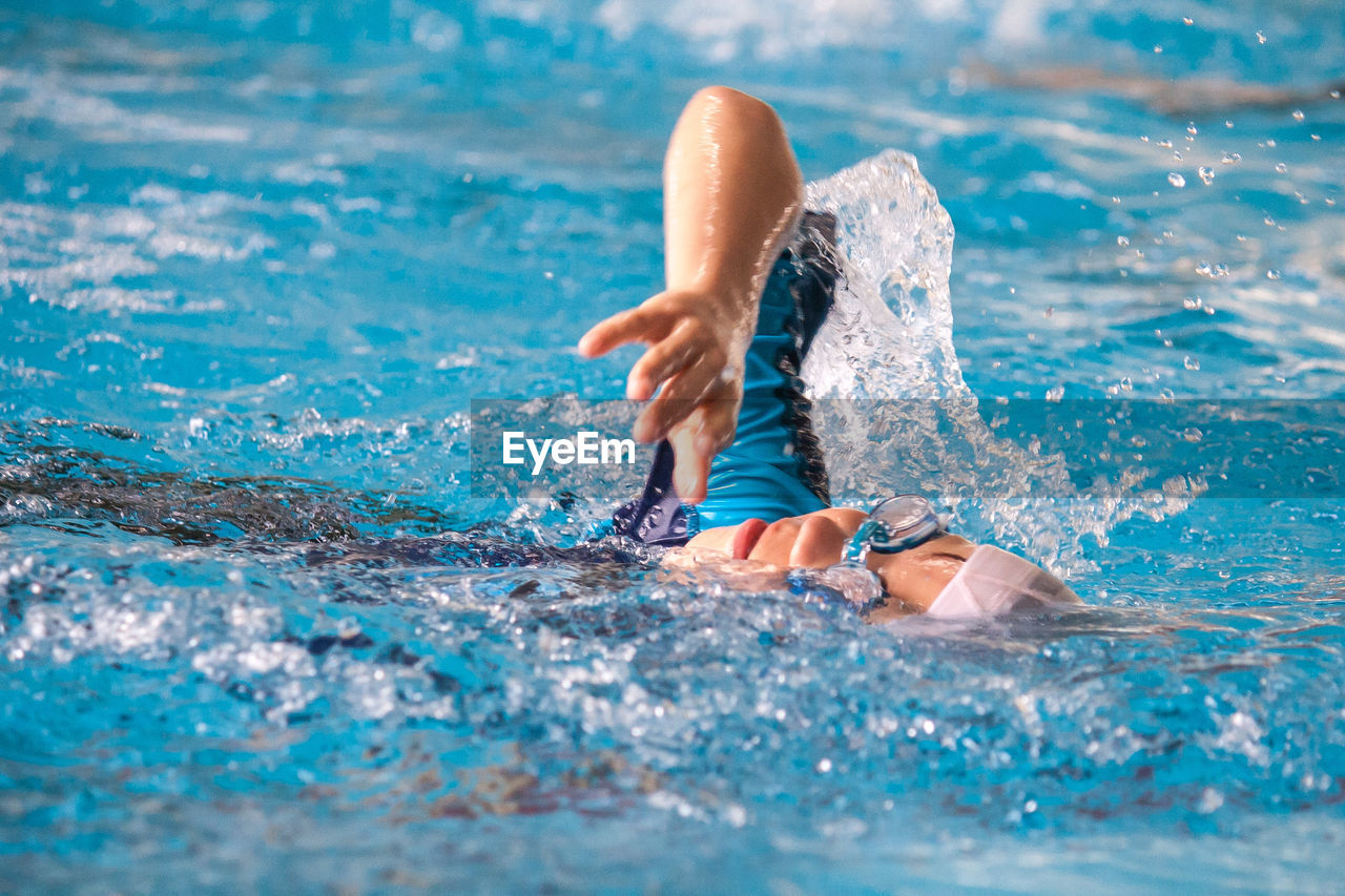 Boy swimming in pool