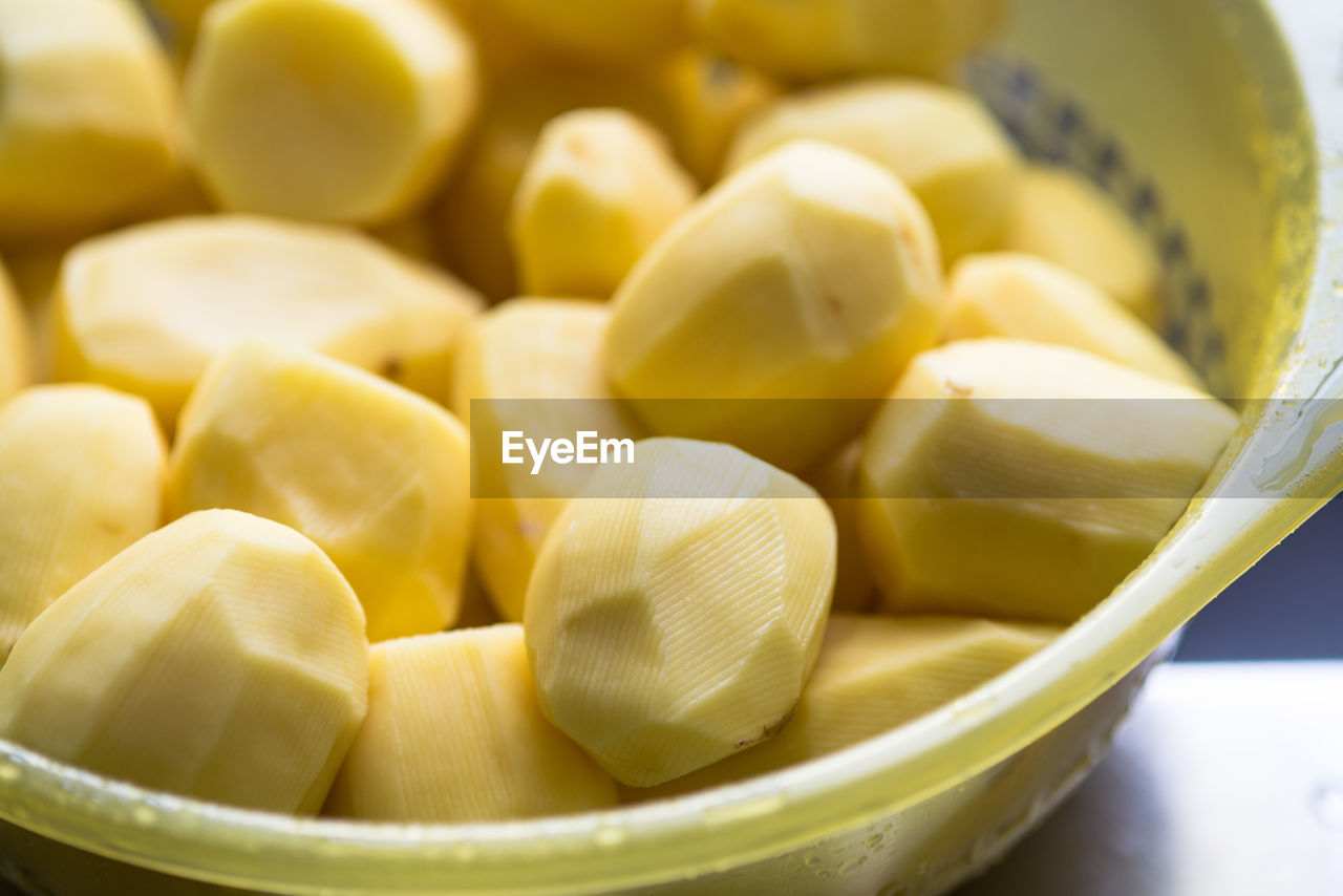 Close-up of boiled potatoes in container