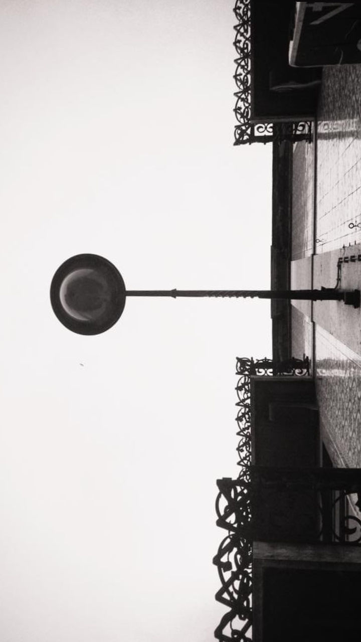 black, lighting, light fixture, street light, white, light, architecture, built structure, black and white, no people, low angle view, monochrome, building exterior, sky, lighting equipment, iron, lamp, monochrome photography, street, clear sky, nature, city, outdoors, day, building