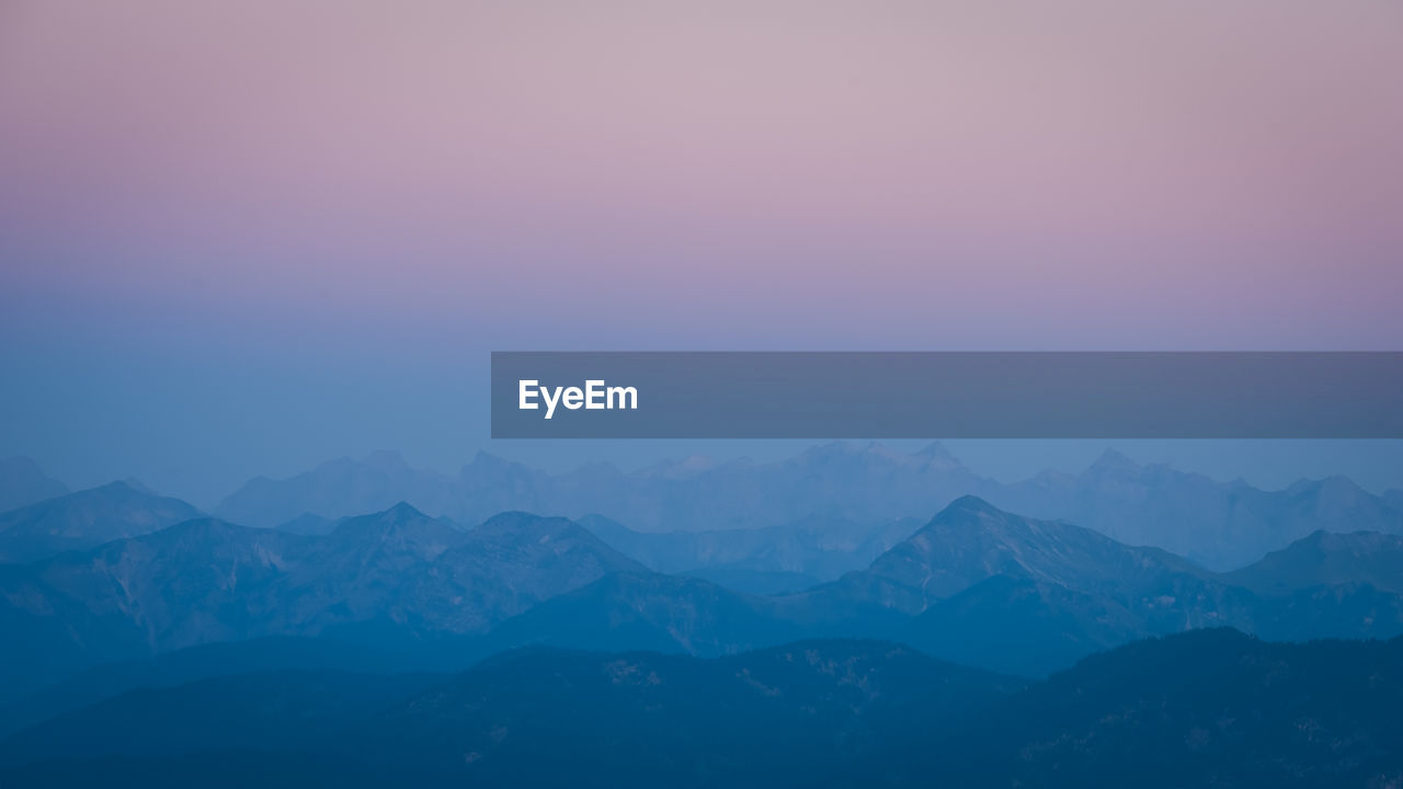 Scenic view of mountains against sky during sunset