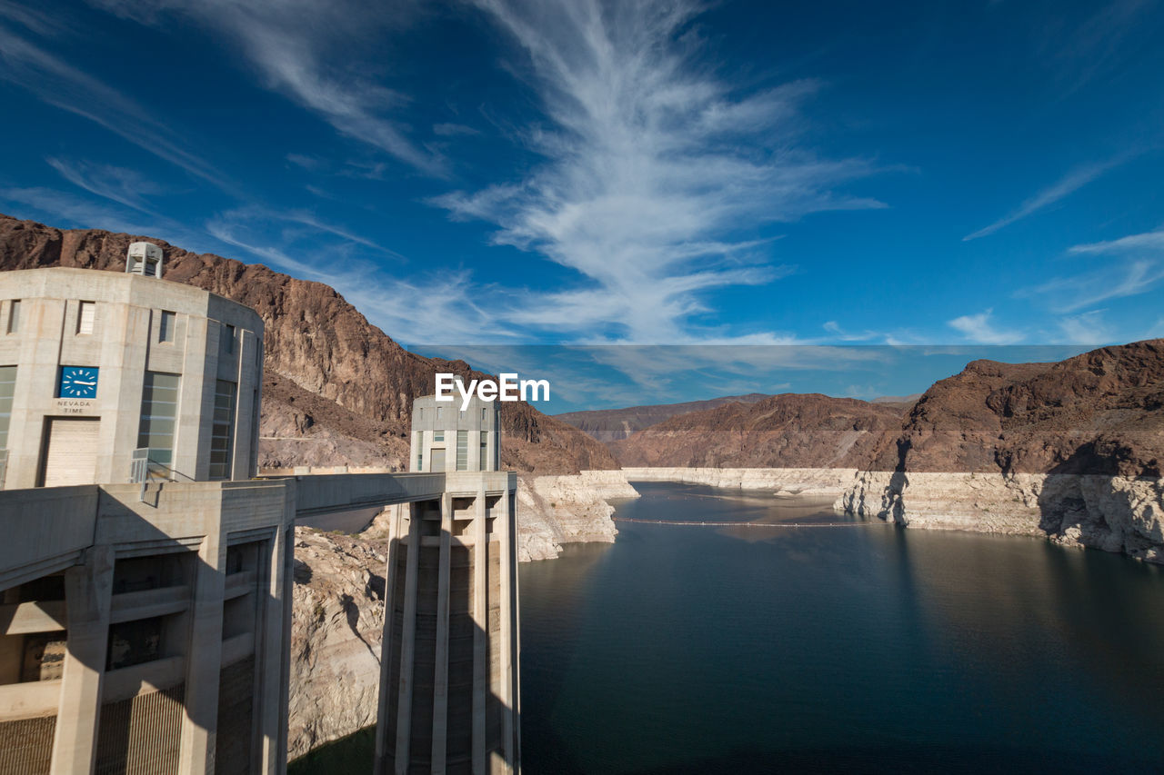 Hoover dam and lake mead with nevada time seen from nevada against cloudy sky