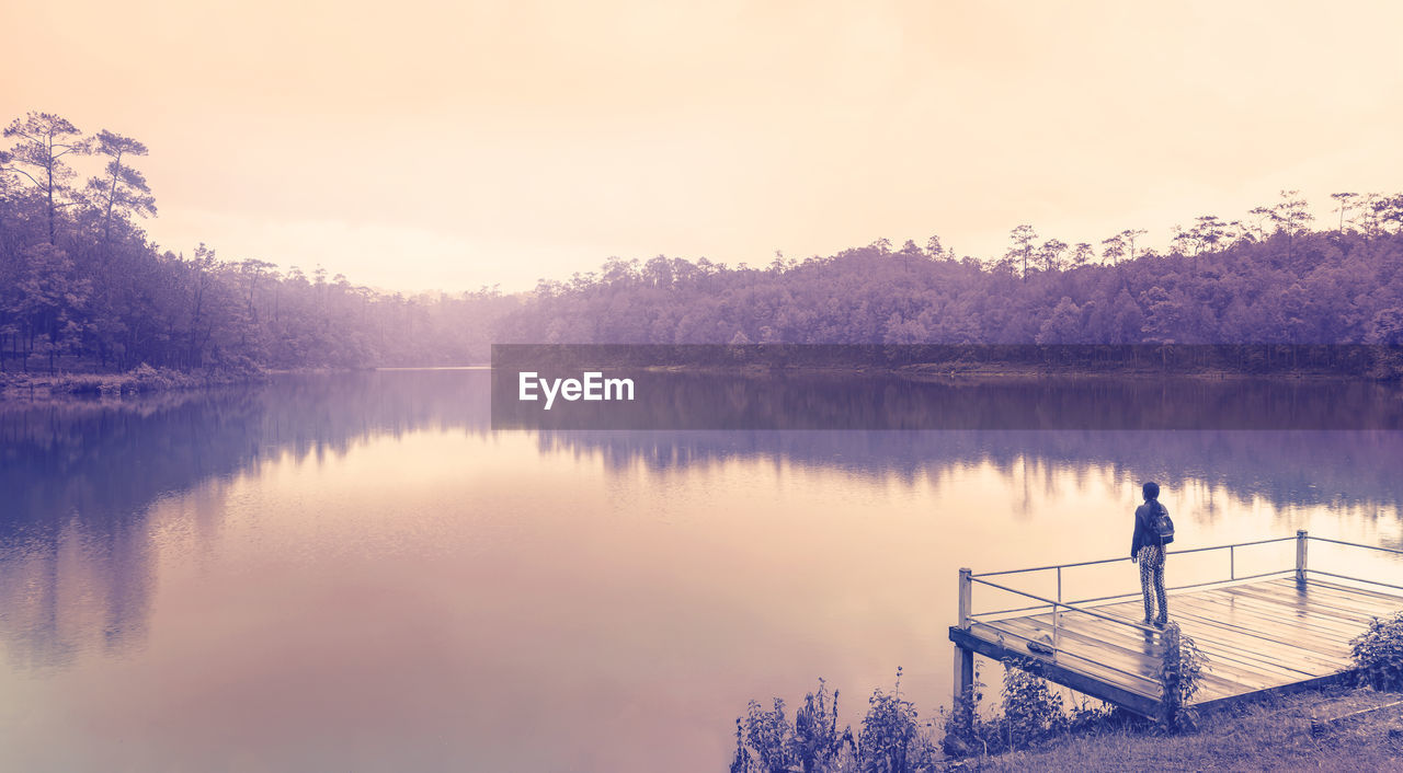 Scenic view of lake against sky during sunset