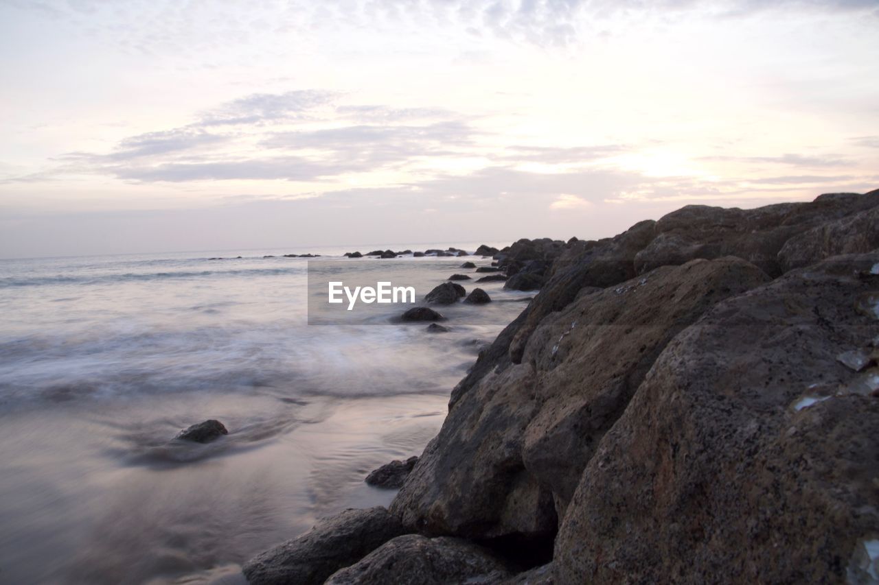 Scenic view of sea against sky at sunset