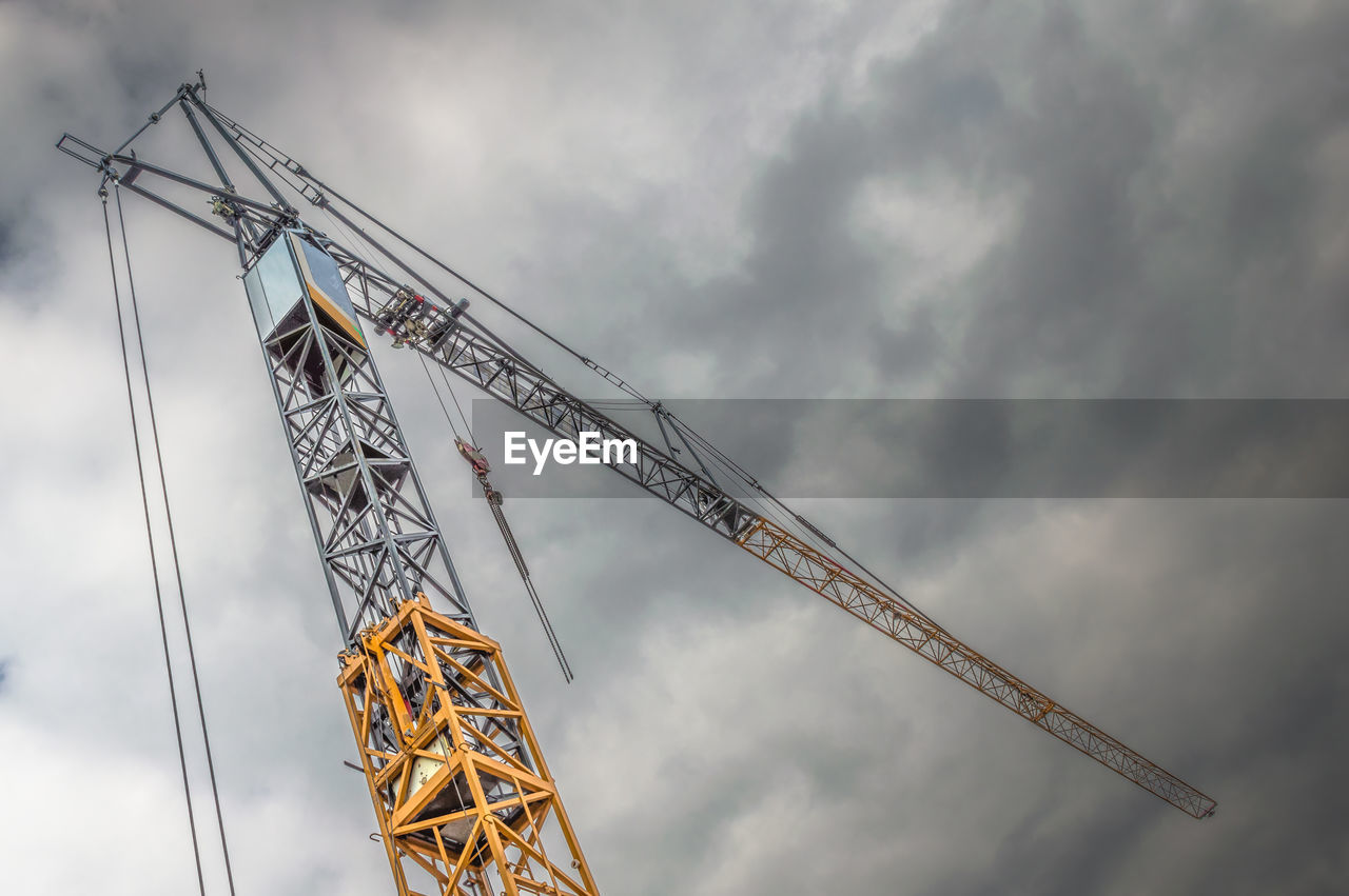 LOW ANGLE VIEW OF CONSTRUCTION SITE AGAINST SKY