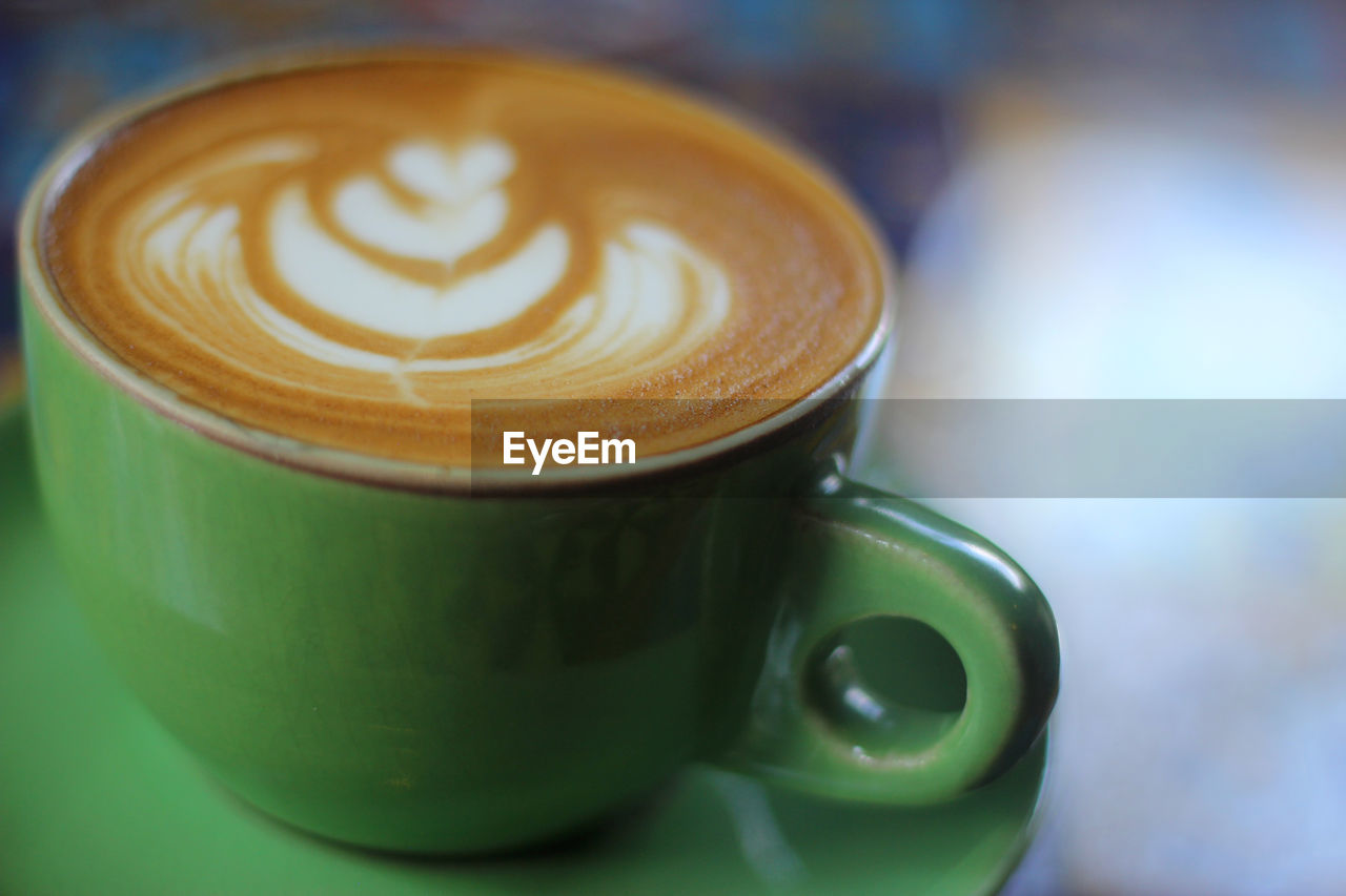 Close-up of cappuccino on table