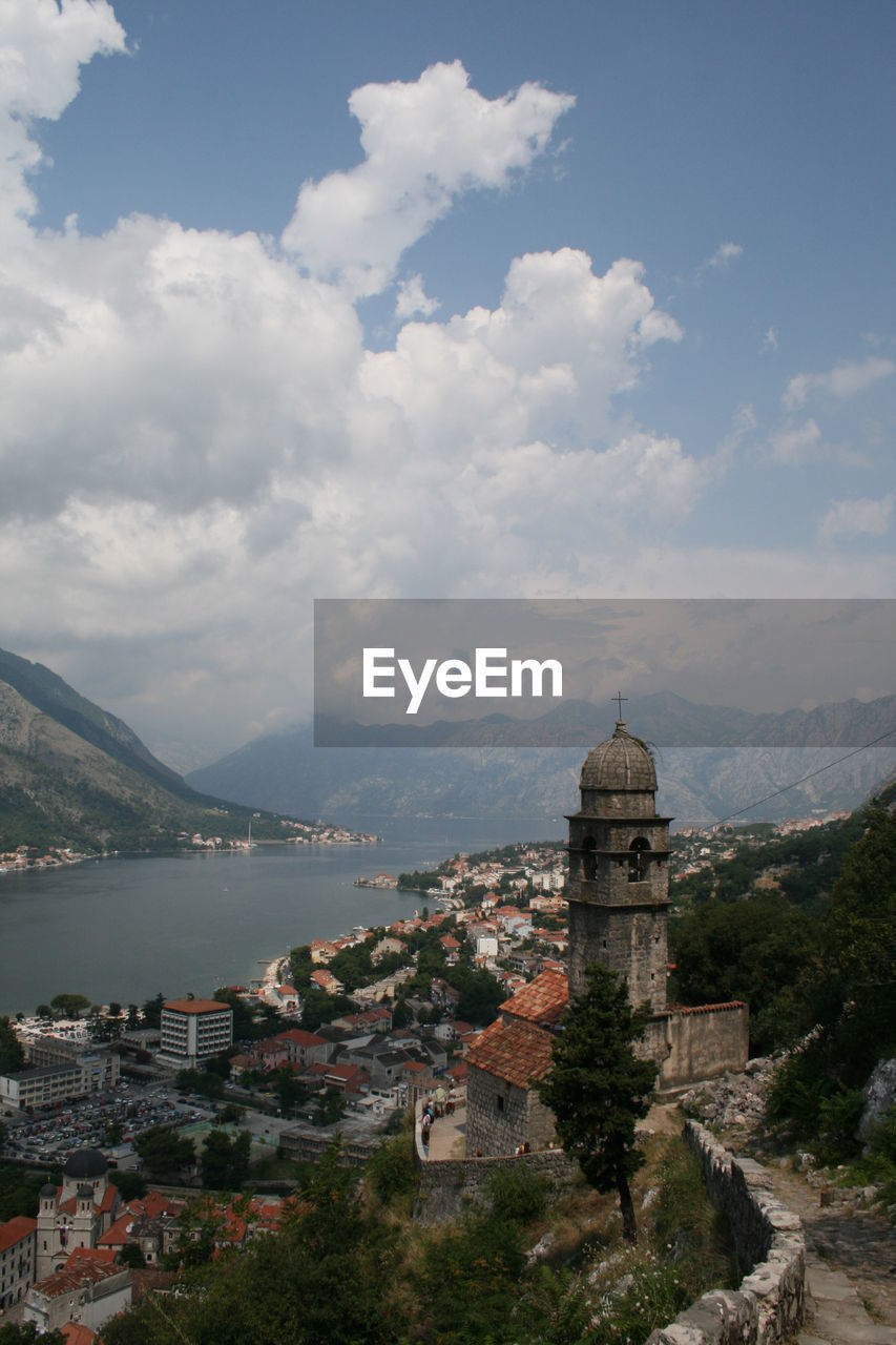 High angle view of town against cloudy sky