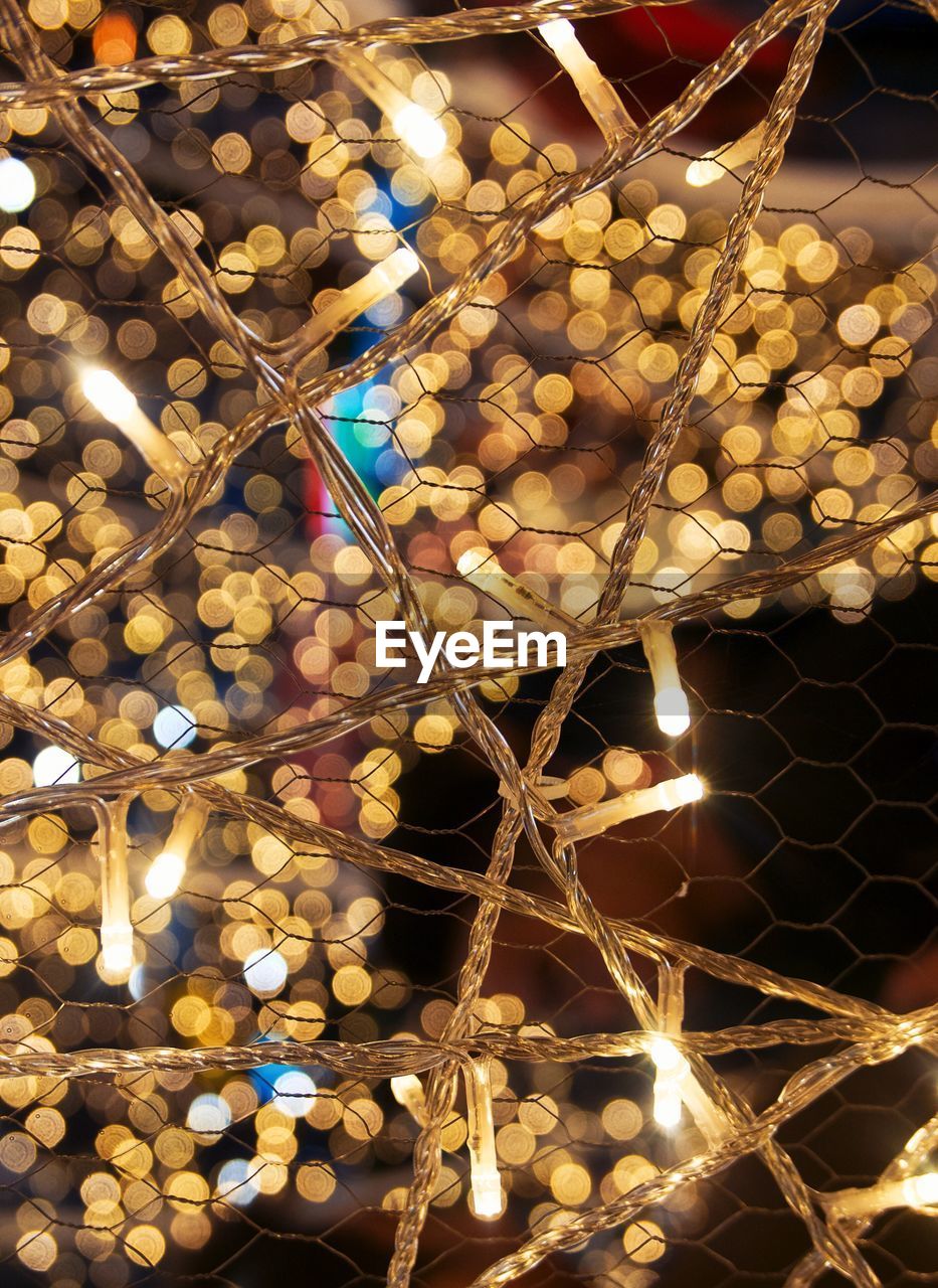 Close-up of illuminated christmas lights at night