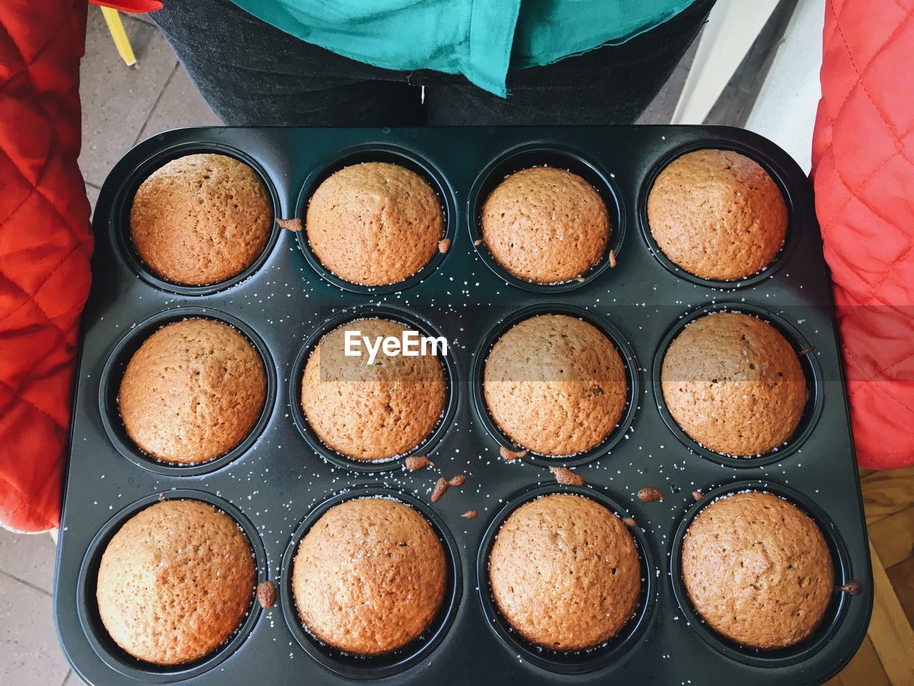 Midsection of person carrying cookie in container