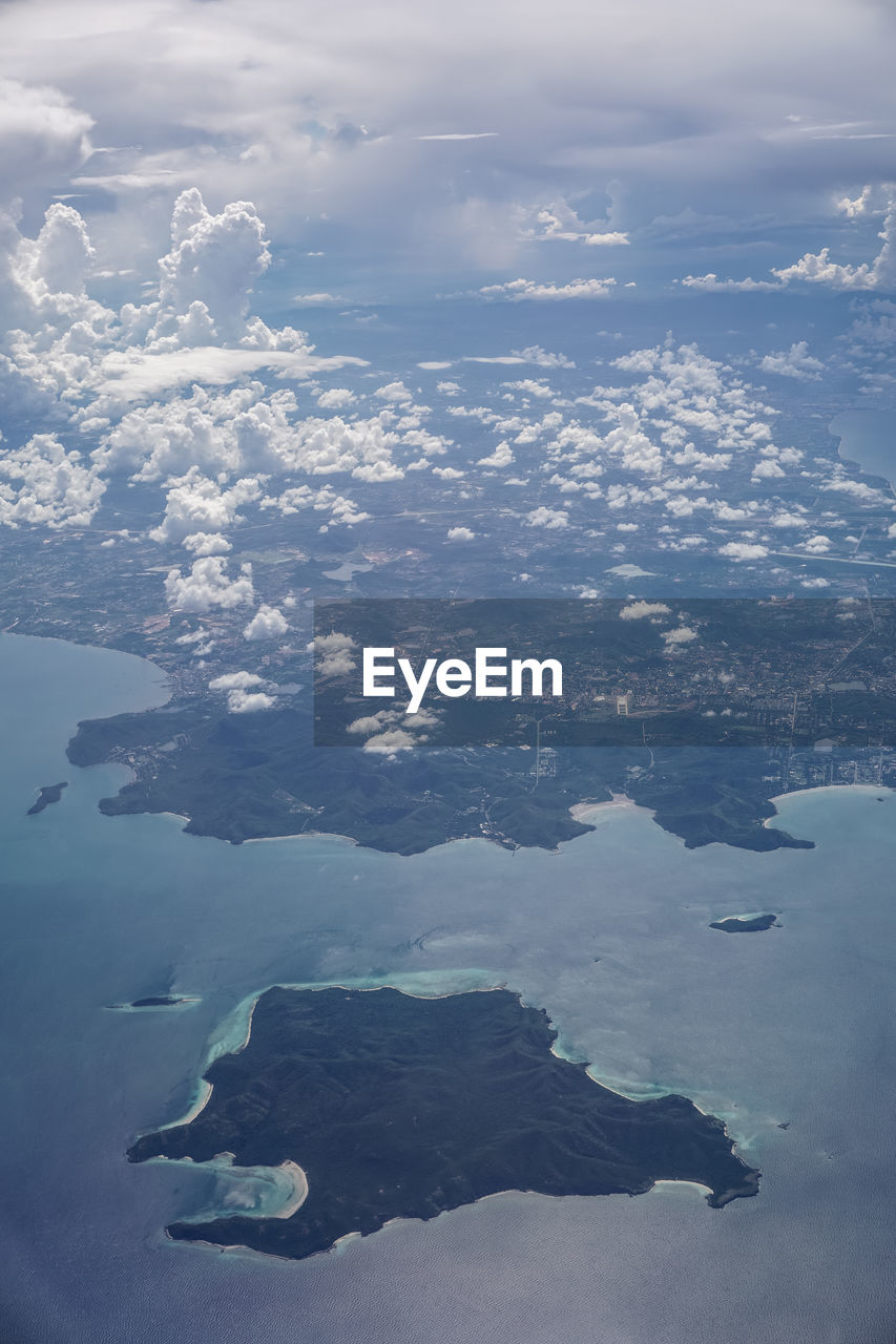 AERIAL VIEW OF ISLAND AMIDST SEA