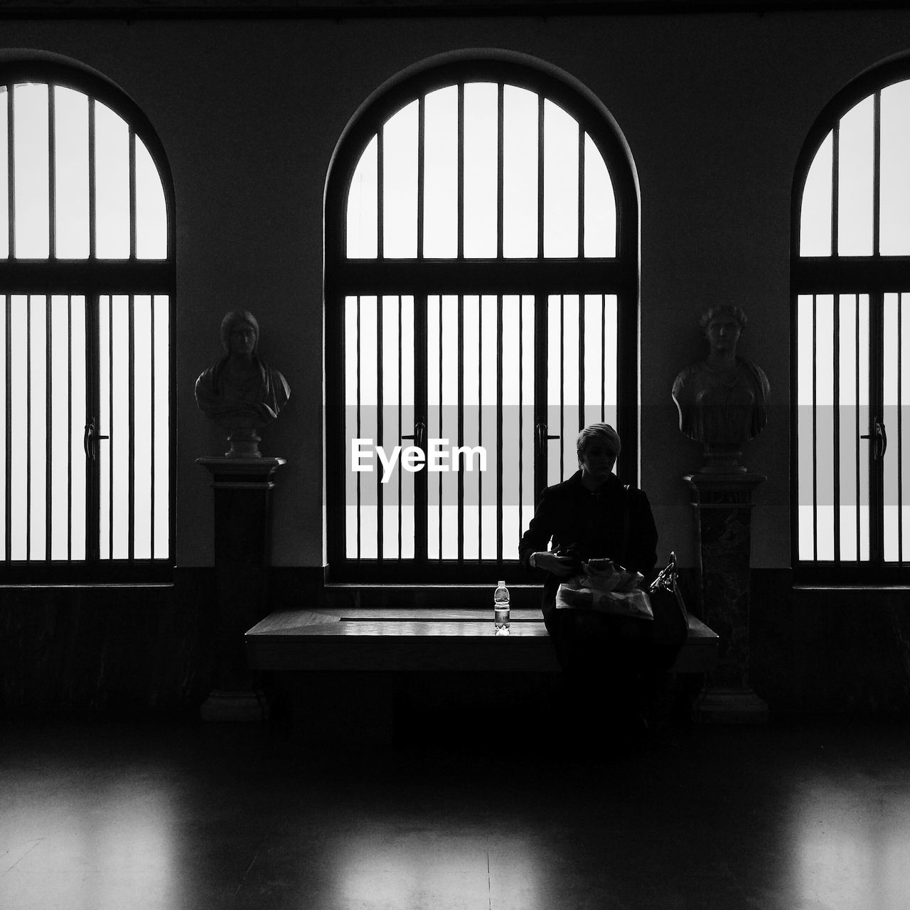 WOMAN WALKING ON RAILING