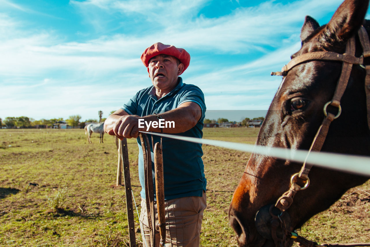 Portrait of farmer and his horse