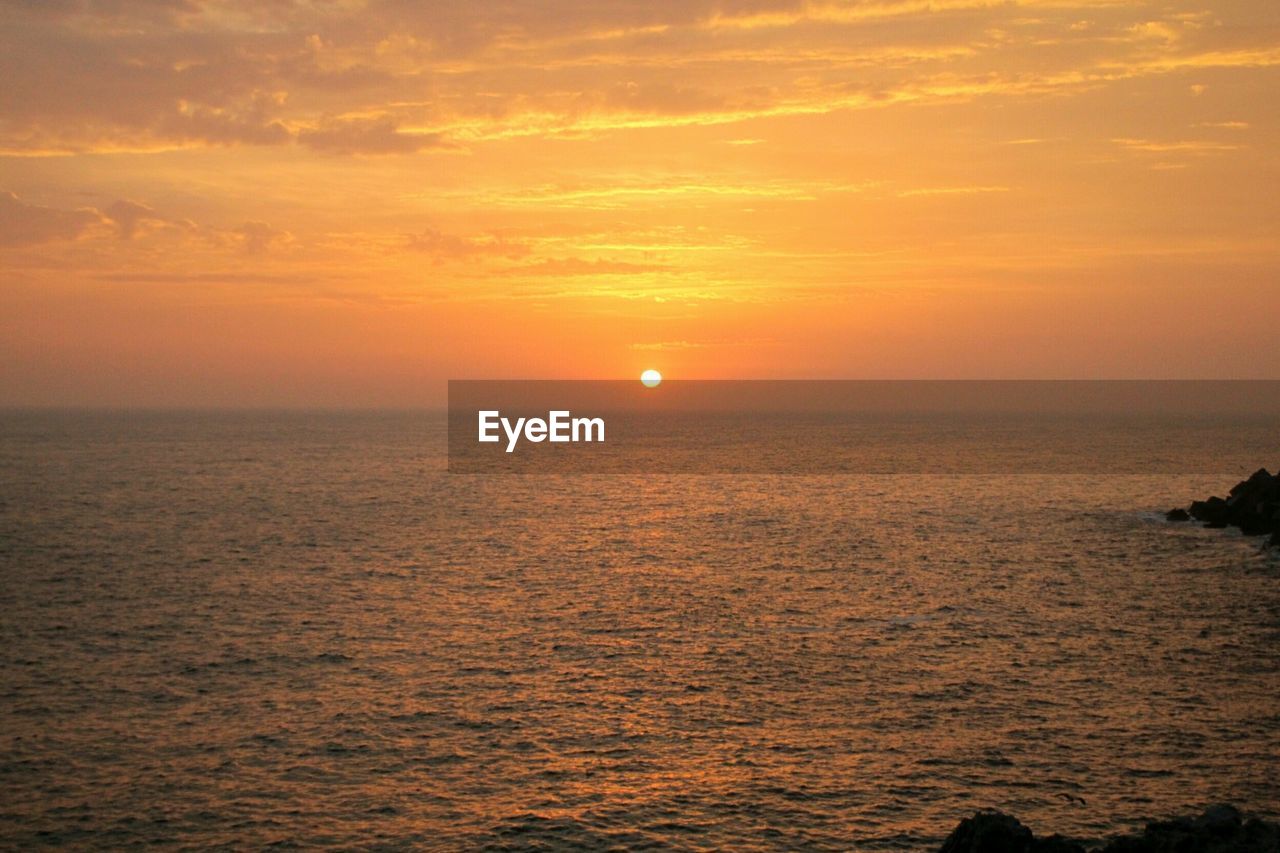 Scenic view of sunset over sea