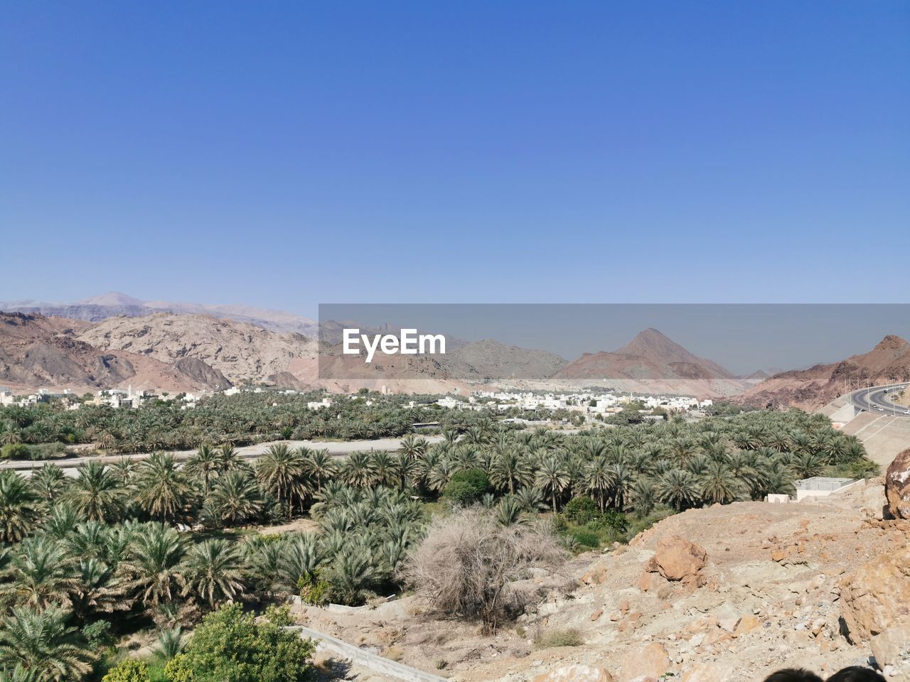 Scenic view of landscape against clear blue sky