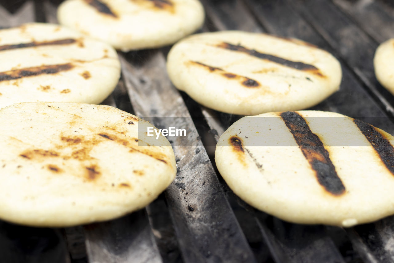 CLOSE-UP OF BREAD ON BARBECUE