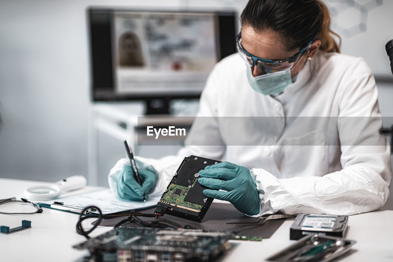 Female scientist working at crime laboratory