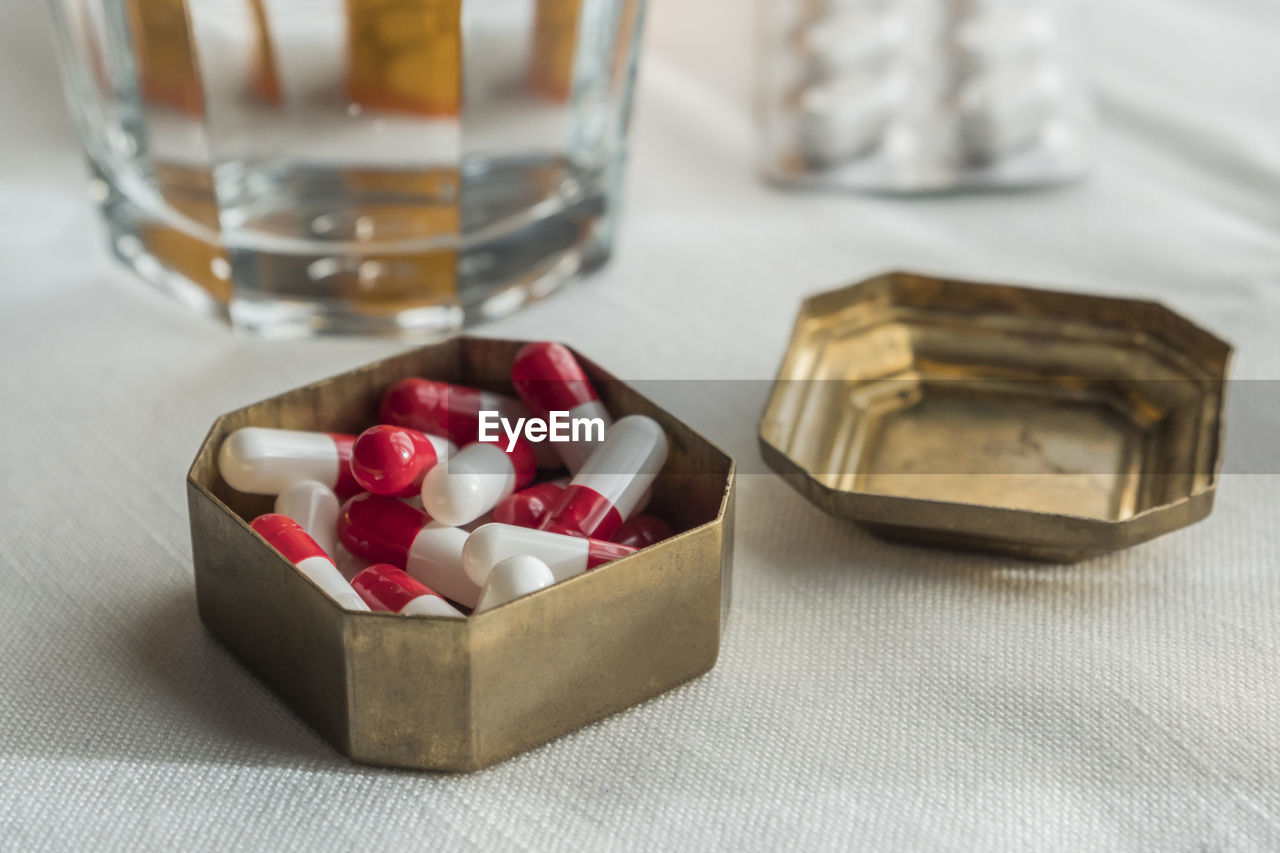 CLOSE-UP OF ICE CREAM IN GLASS ON TABLE