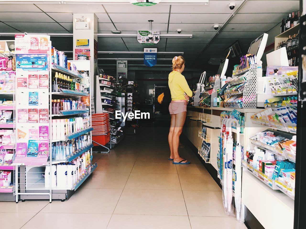 FULL LENGTH OF MAN STANDING ON STORE