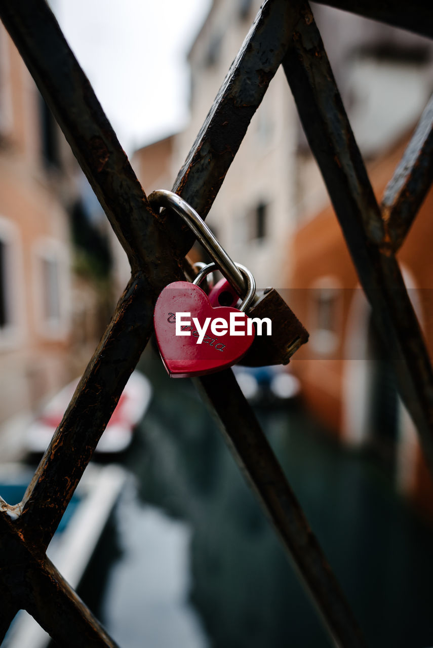 Close-up of padlocks on railing