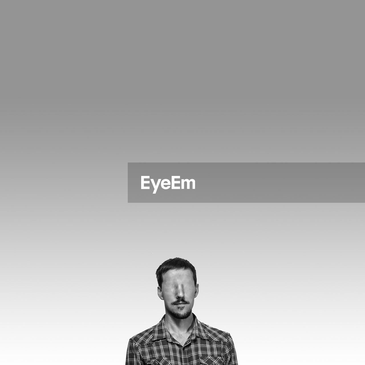 Digital composite image of blind man against gray background