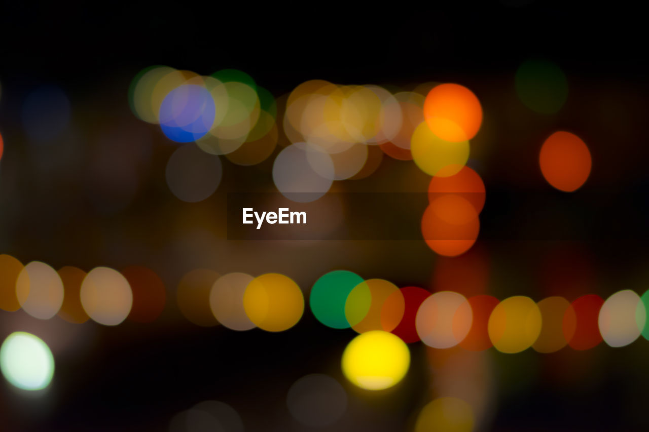 Defocused image of illuminated lights at night