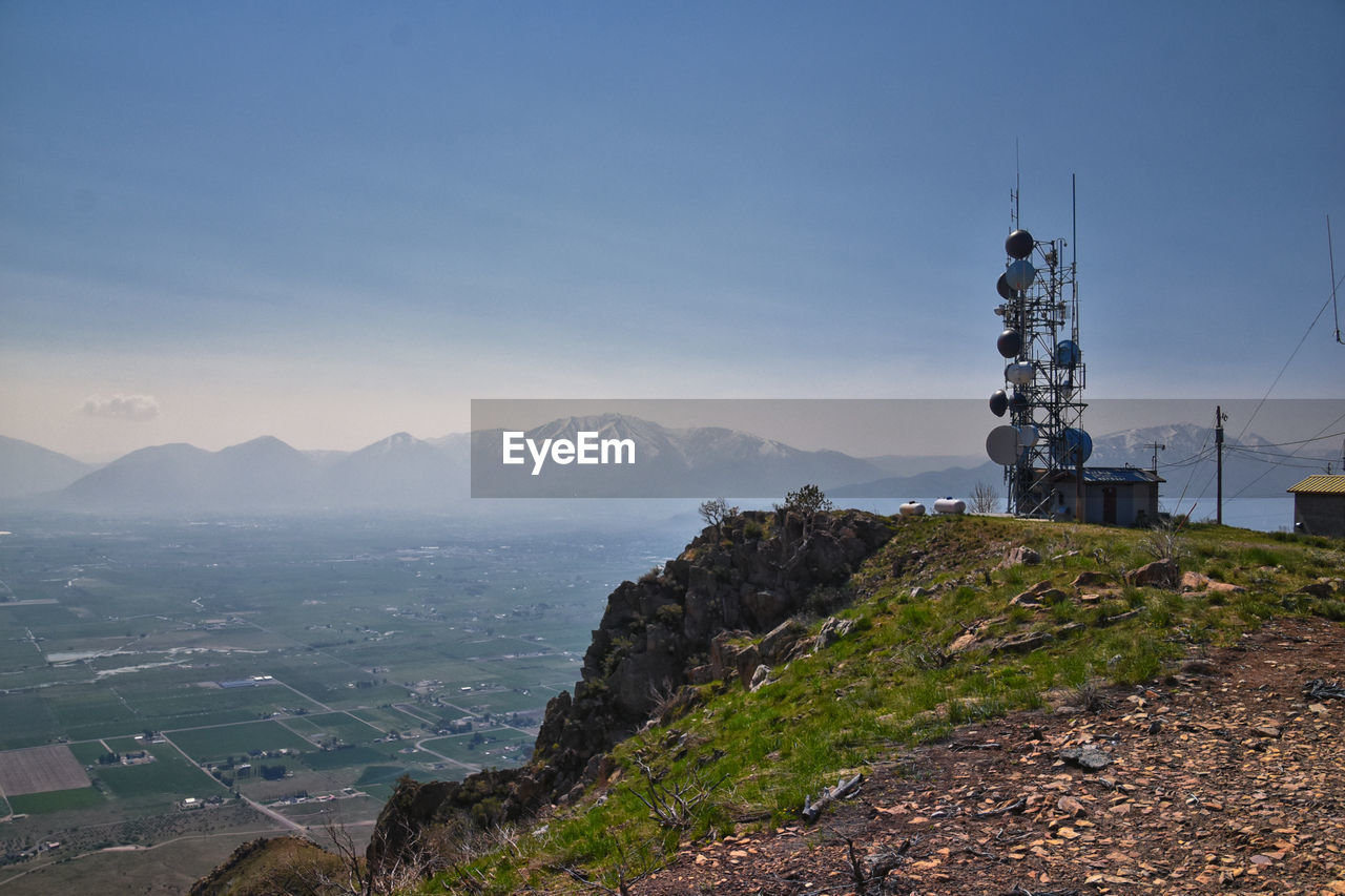 scenic view of sea and mountains against clear sky
