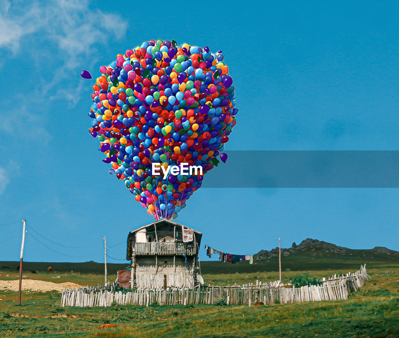 sky, toy, balloon, nature, multi colored, blue, hot air balloon, architecture, cloud, plant, day, outdoors, landscape, built structure, no people, flower, land, environment, kite sports