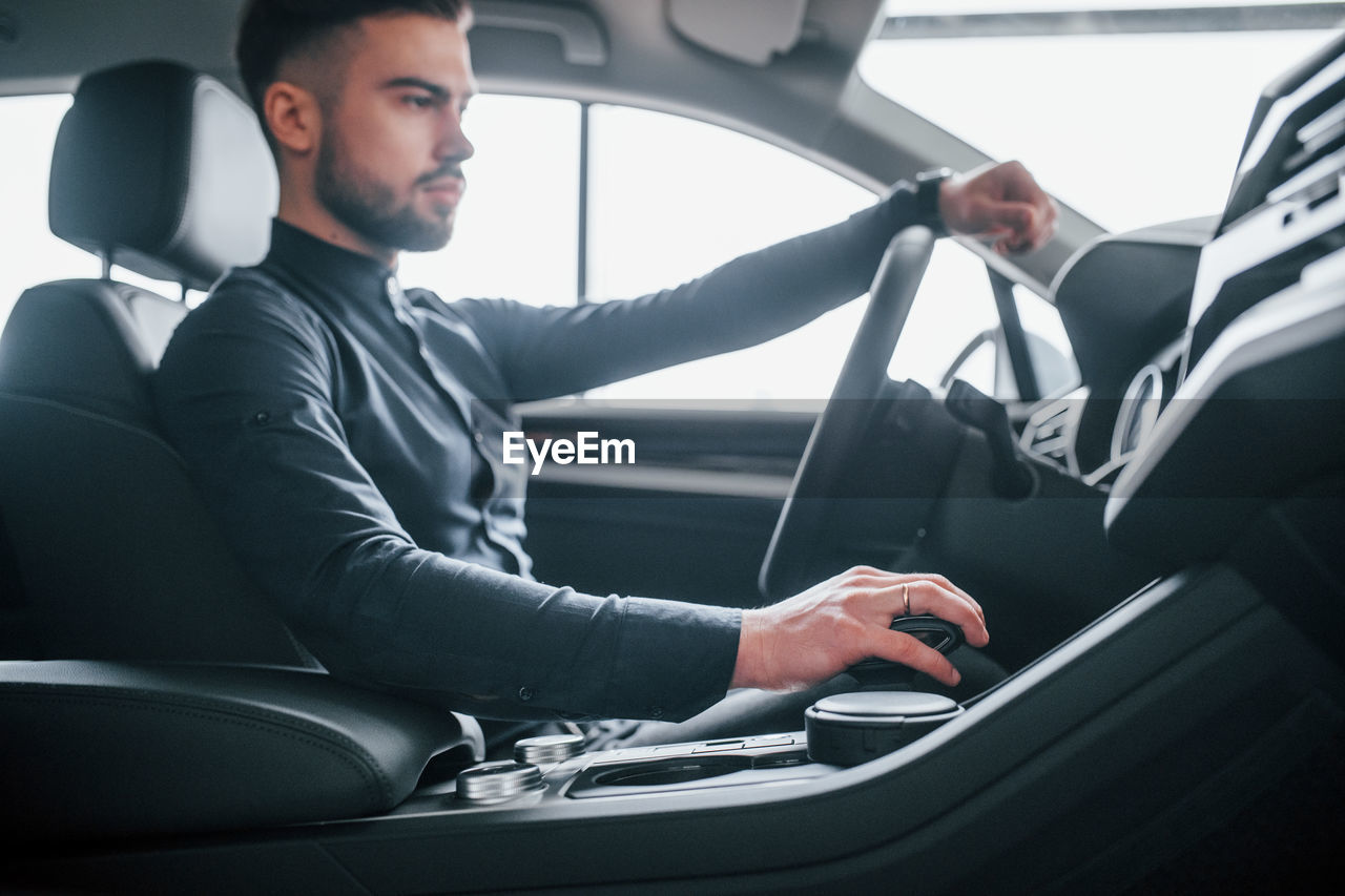 rear view of woman sitting in car