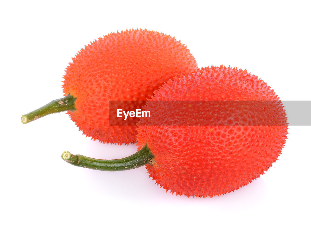 Close-up of fruits over white background