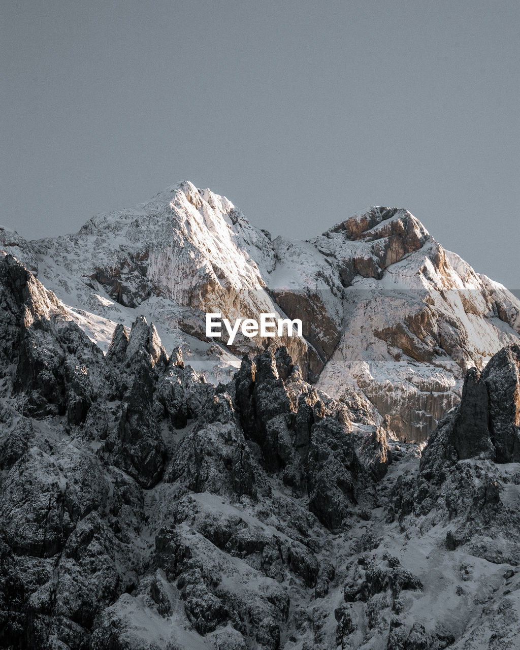 scenic view of snowcapped mountains against blue sky