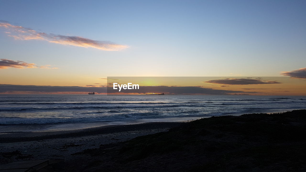 Scenic view of beach during sunset