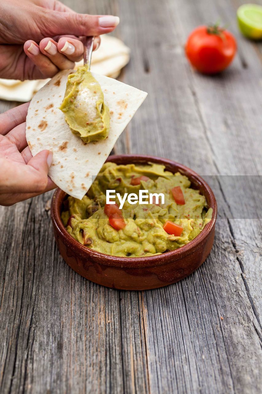 Close-up of hand preparing food