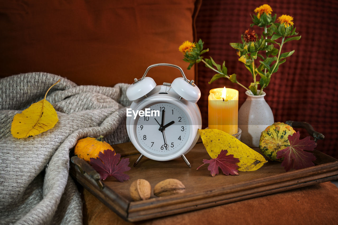 clock, yellow, alarm clock, time, plant, no people, indoors, food and drink, flower, food, wood, flowering plant, still life photography, furniture, still life, healthy eating, nature, wellbeing, table, fruit, studio shot, rustic, domestic room