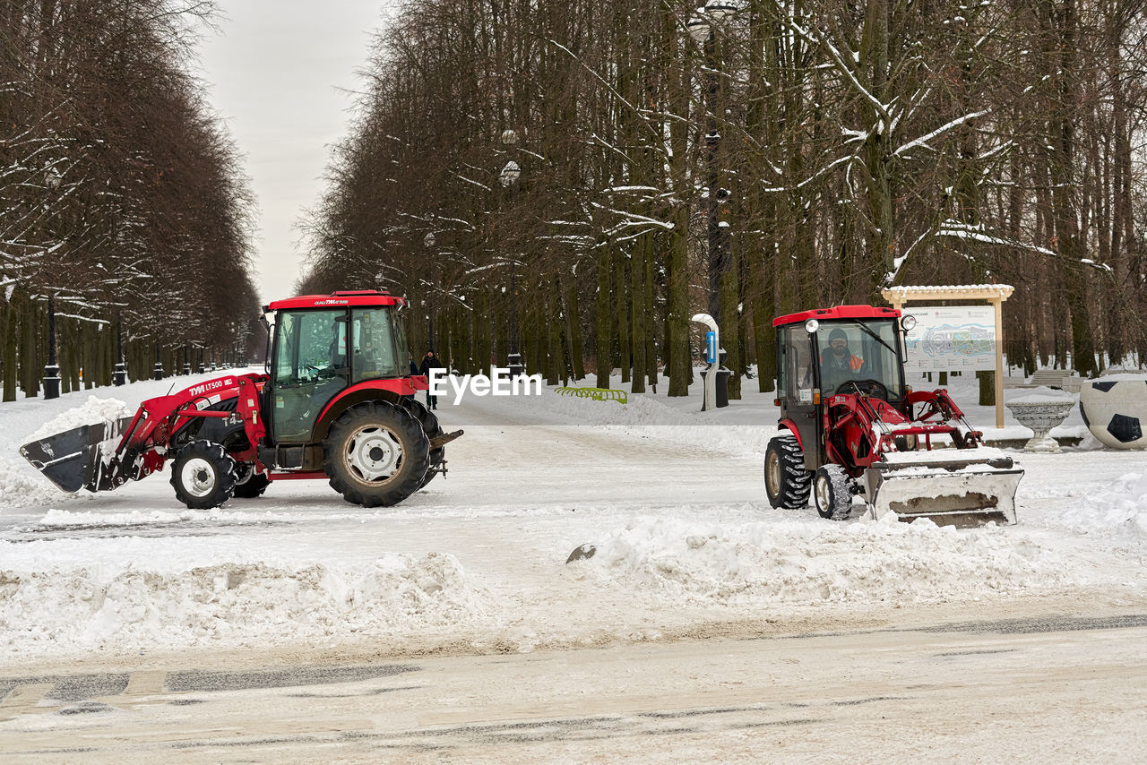 TRACTOR ON ROAD DURING WINTER SEASON