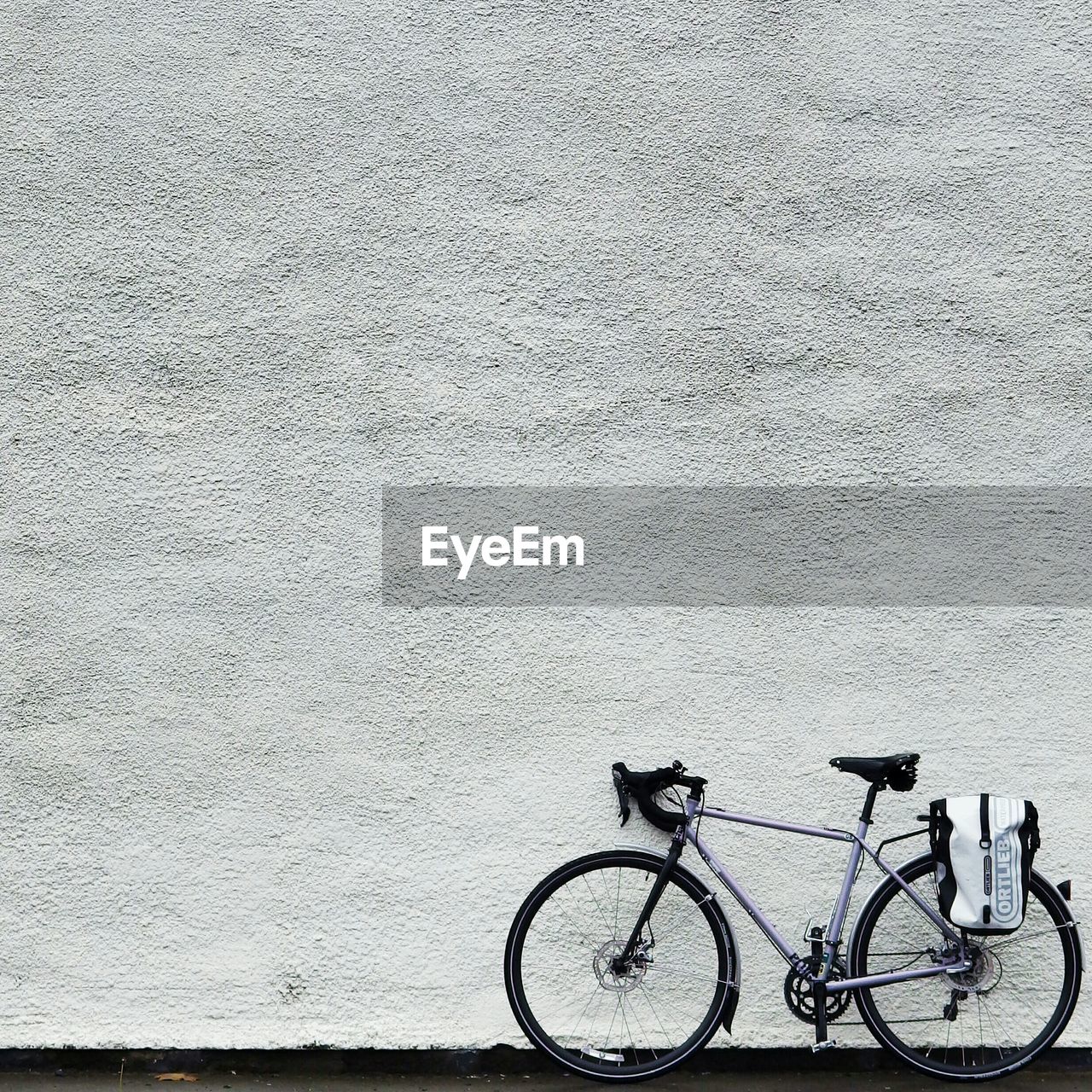 BICYCLES PARKED ON WALL