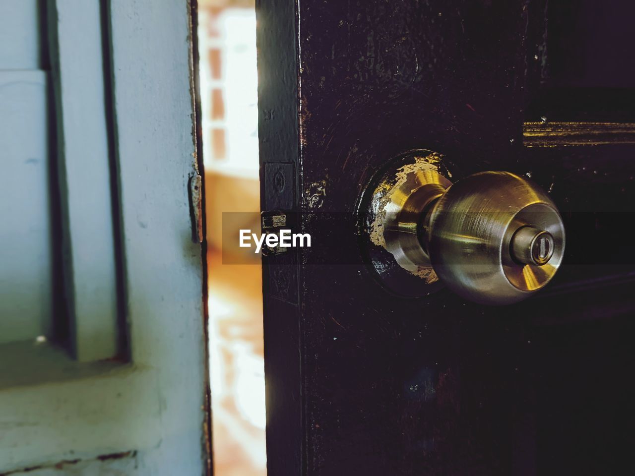 door, light, entrance, door handle, close-up, no people, security, knob, metal, protection, lock, doorknob, indoors, yellow, darkness, closed, lighting, black