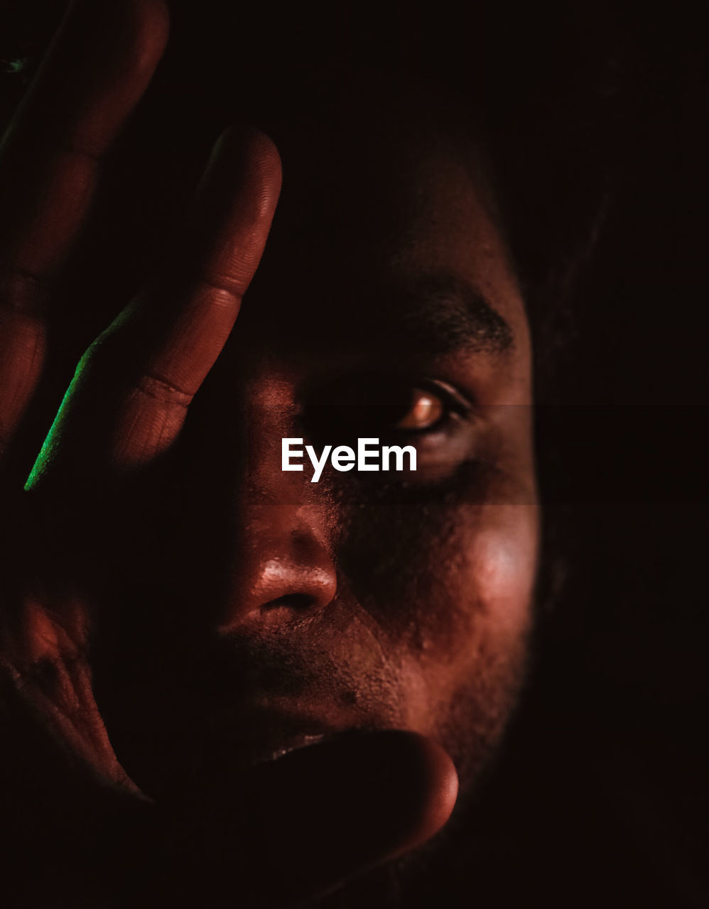 CLOSE-UP PORTRAIT OF YOUNG MAN WITH EYES