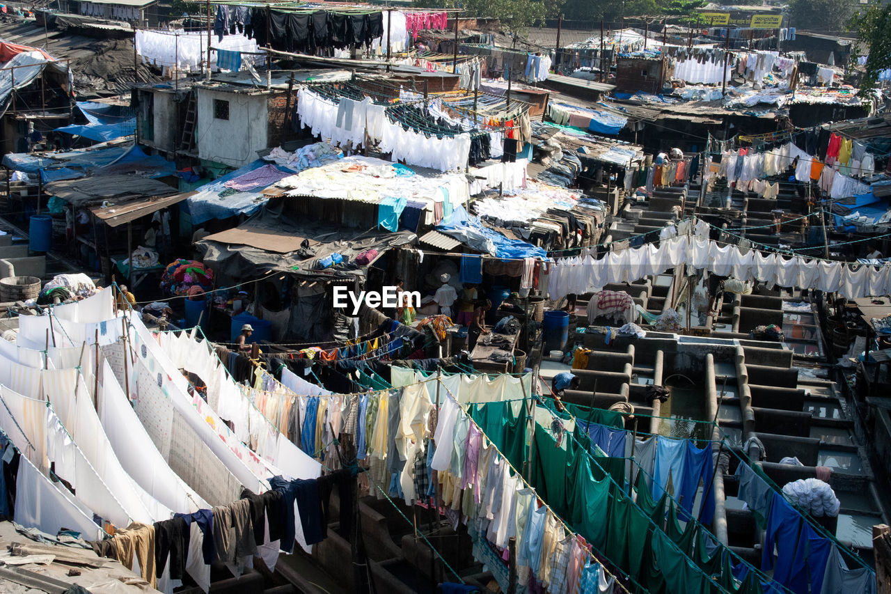 Clothes drying by slum at laundry