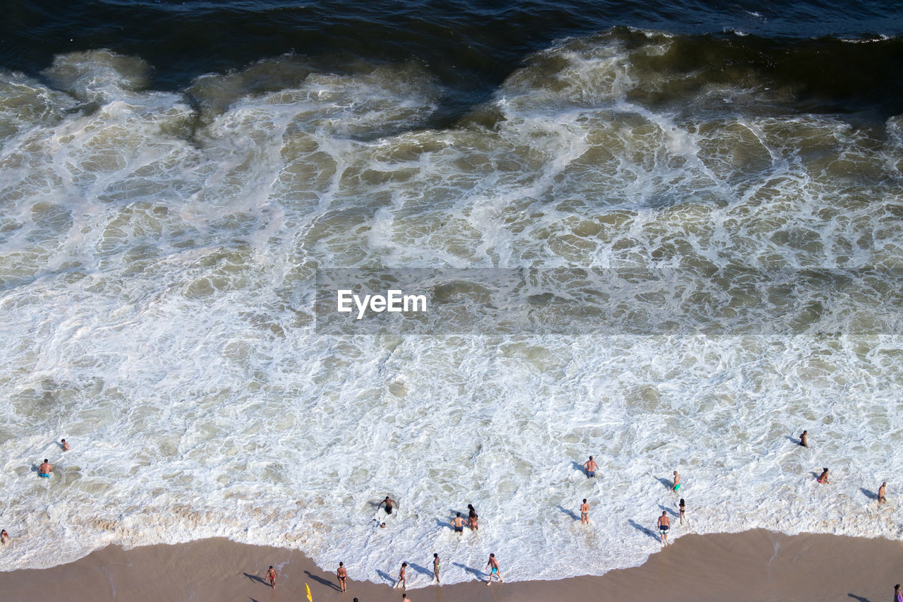 Aerial view of people enjoying at beach