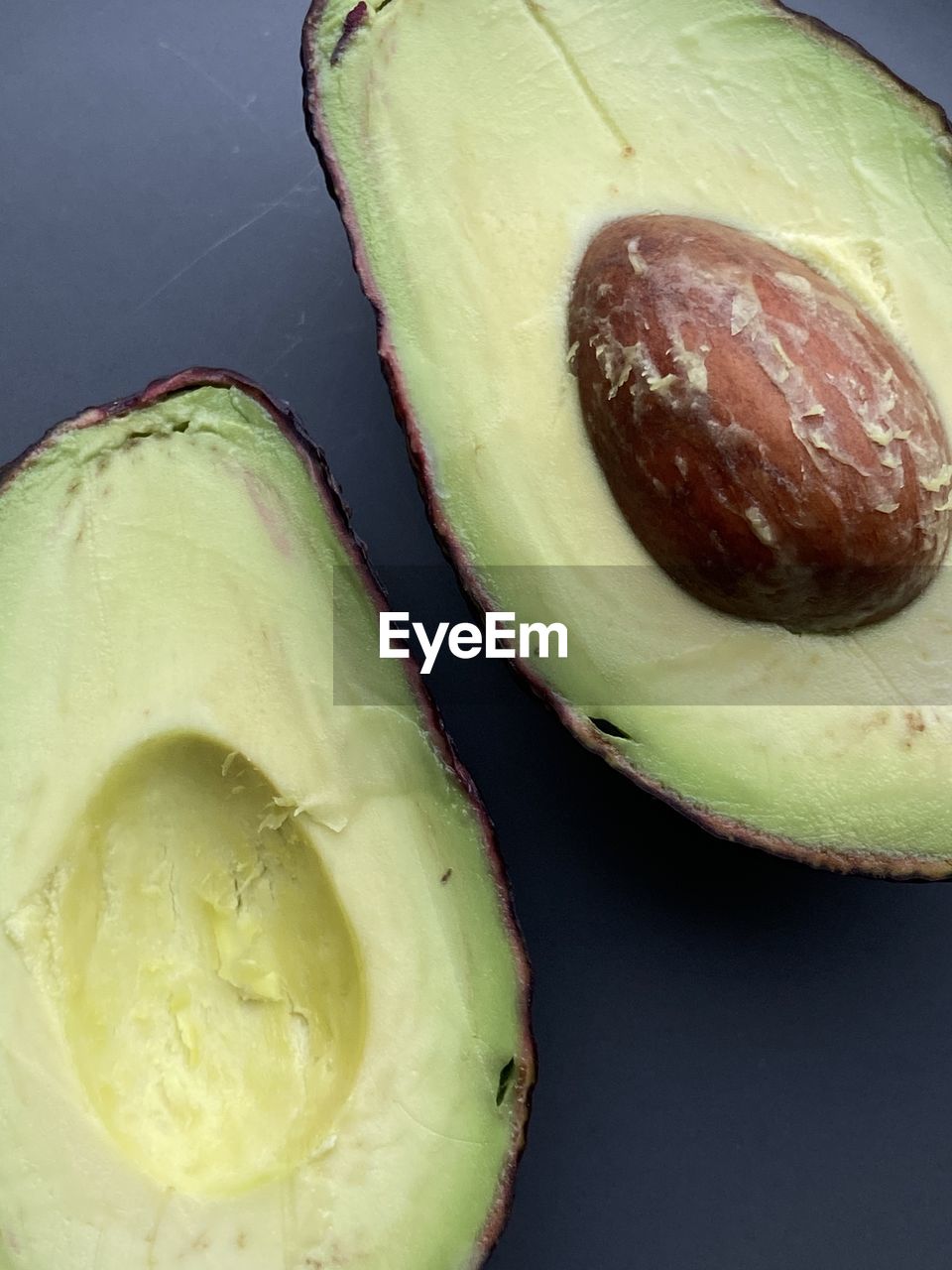 food and drink, food, healthy eating, freshness, plant, wellbeing, produce, fruit, indoors, studio shot, no people, slice, still life, close-up, cross section, halved, avocado, vegetable