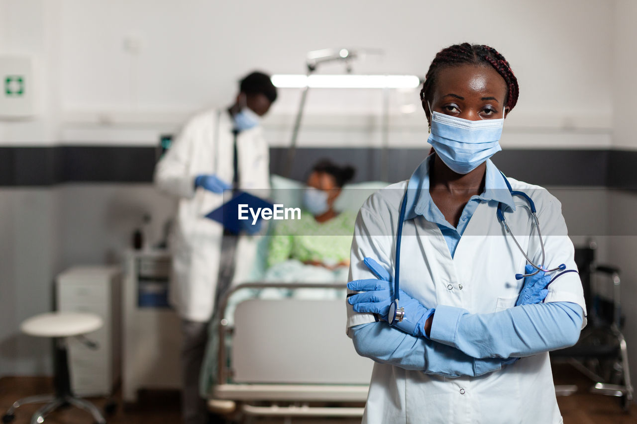 Portrait of doctor wearing mask in hospital